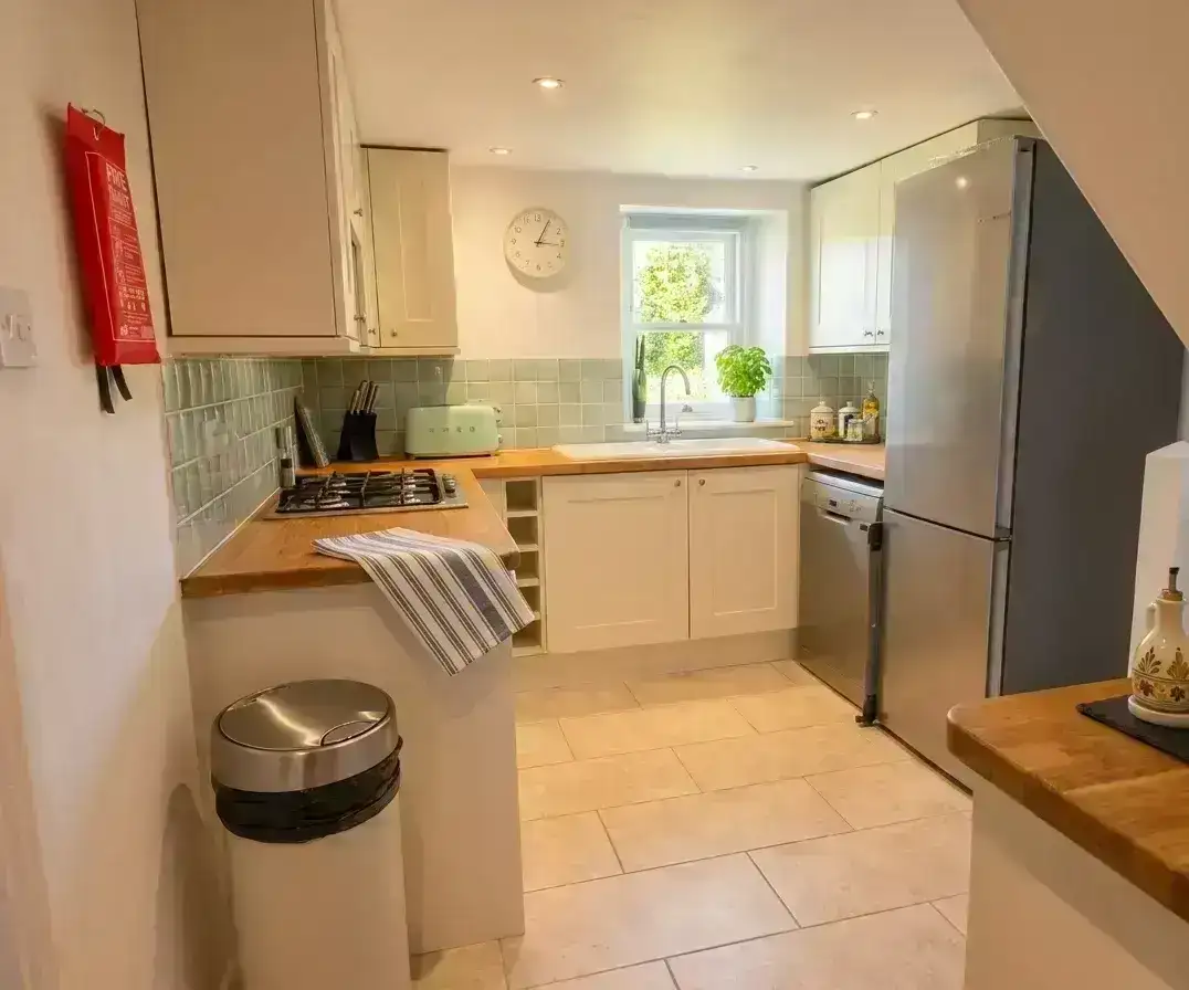 Bright and welcoming holiday cottage kitchen prepared for arriving guests