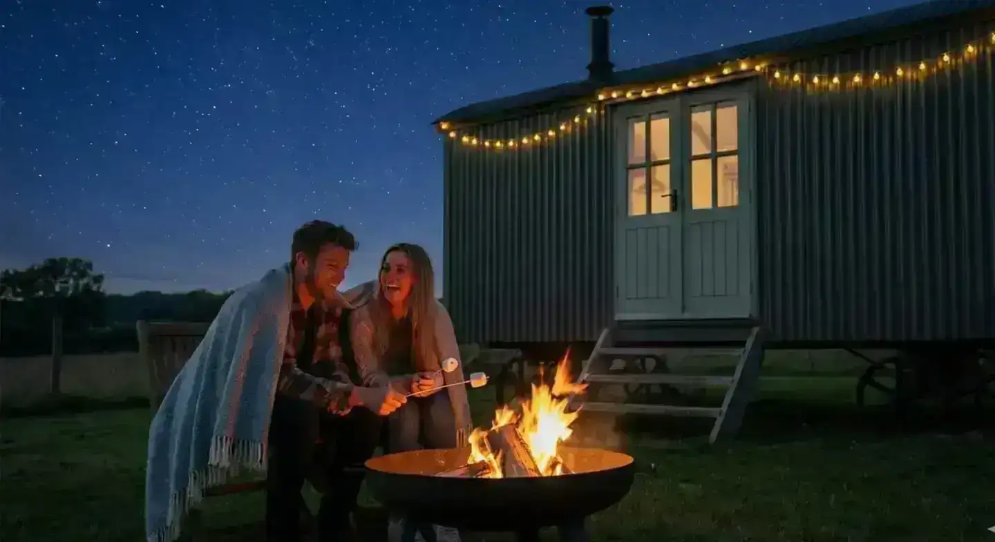 Guests enjoying an evening by the firepit at a holiday let