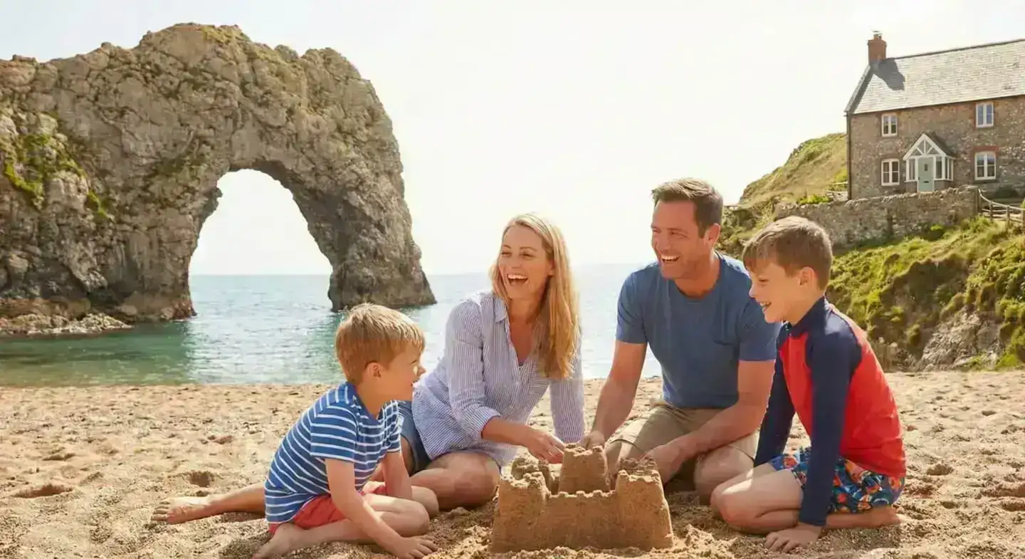 Family walking on the Dorset coast at Durdle Door