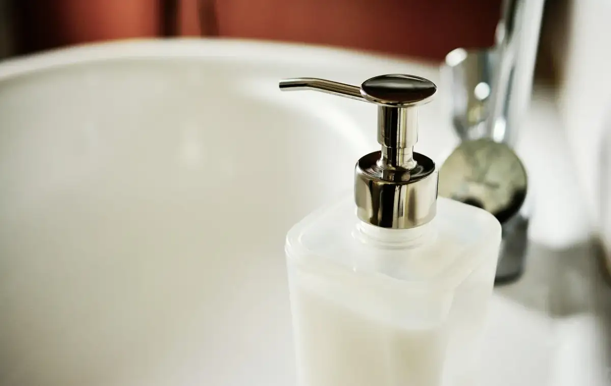 Refillable eco-friendly toiletry dispensers in a holiday let bathroom
