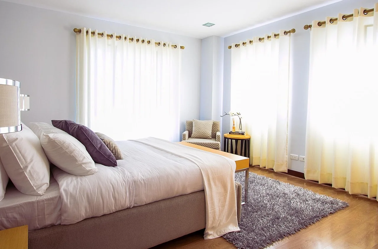 Restful bedroom with soft bedding and natural light